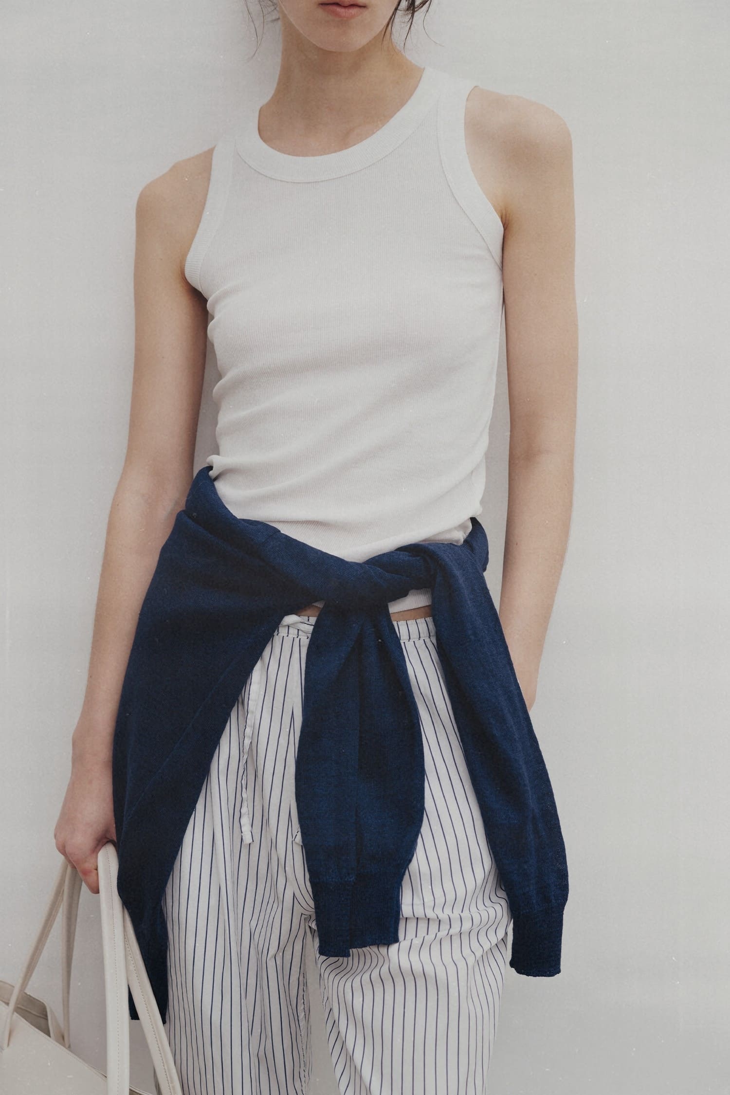 Nothing Written white ribbed cotton tank top worn close-up