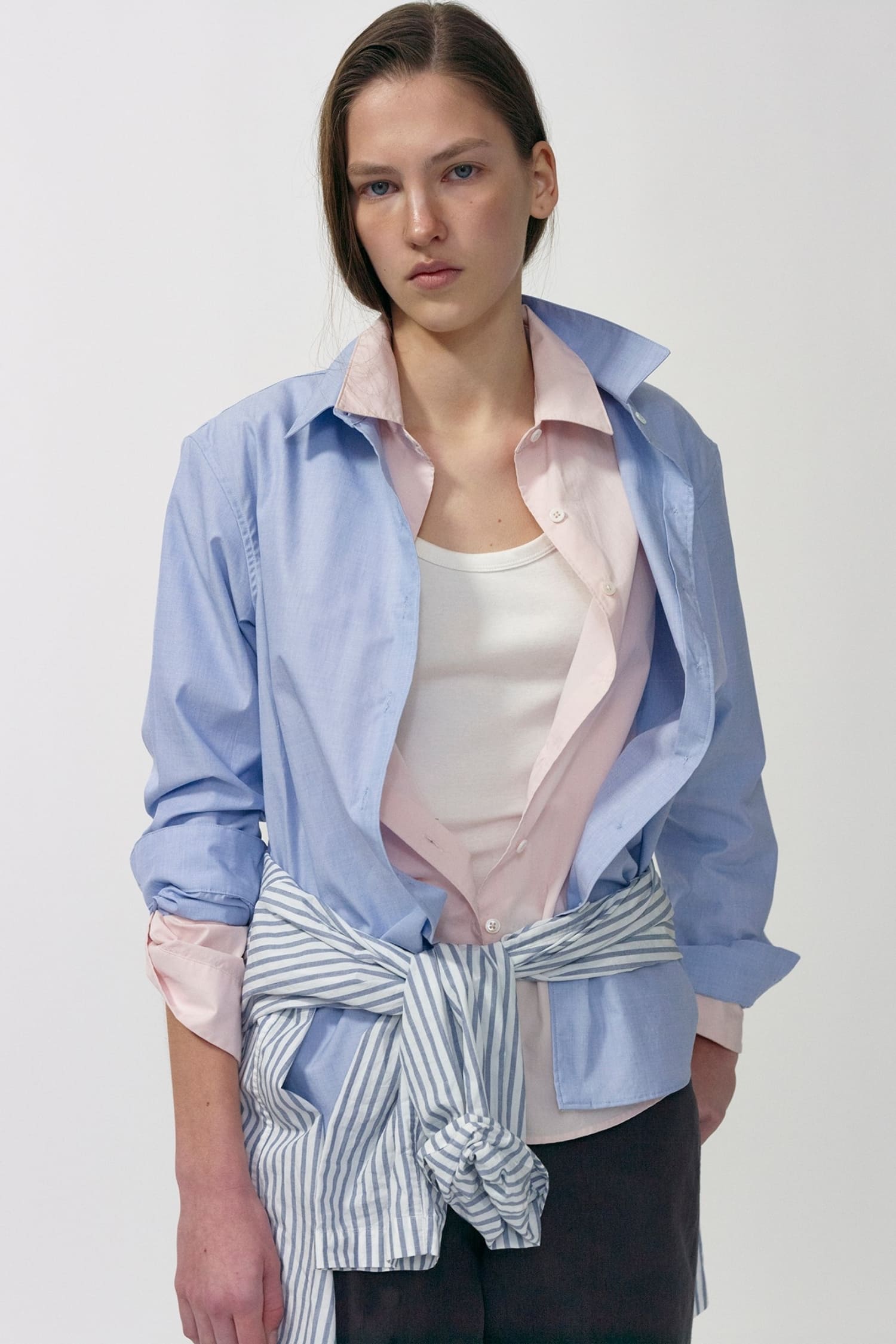 Close-up of Nothing Written light blue fitted cotton shirt with classic collar and button closure