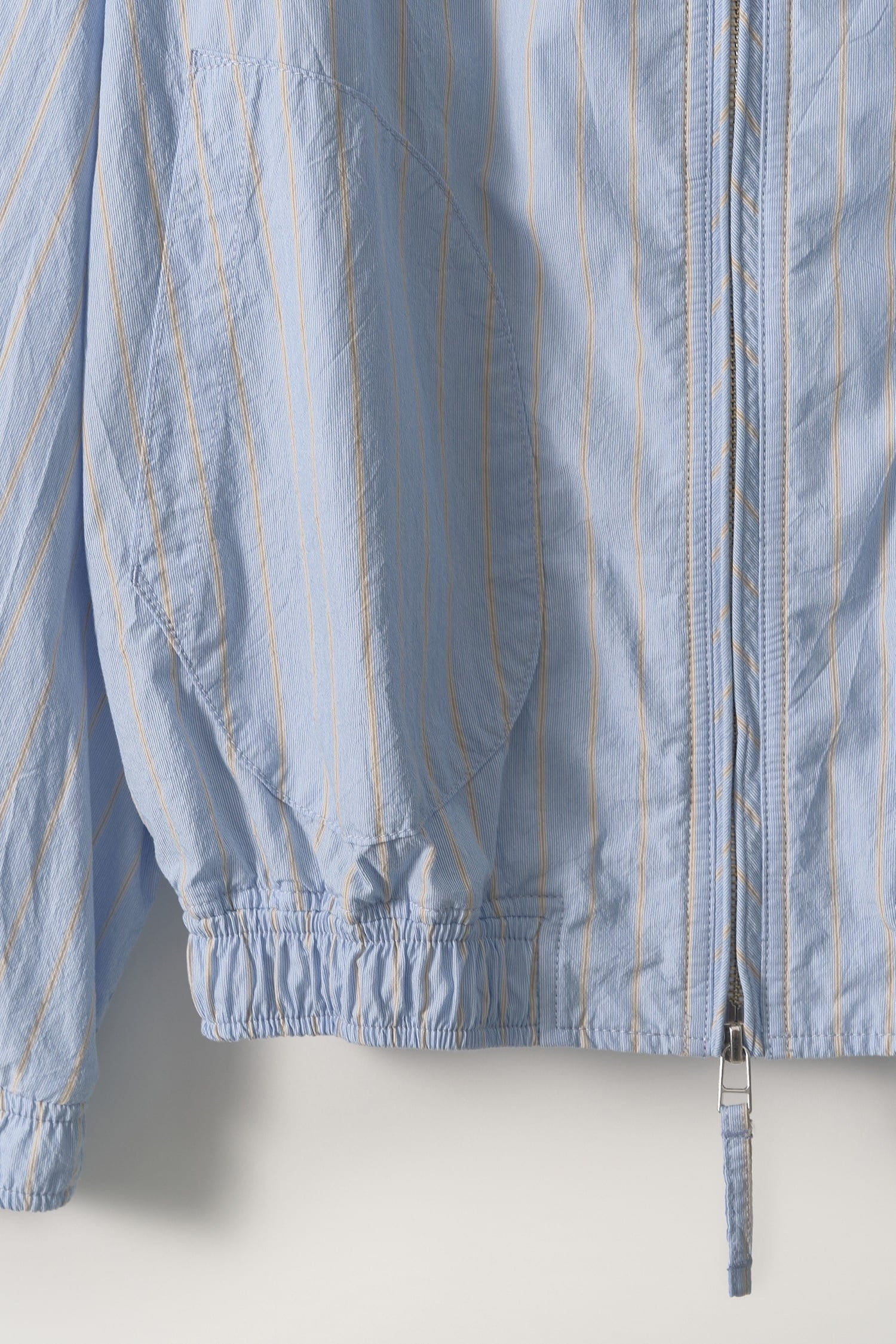 Detail of front pocket on Nothing Written Blue Stripe Zip Jacket