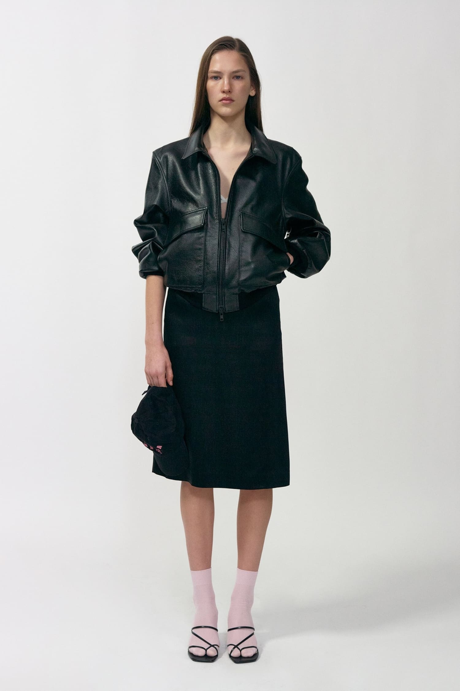 Nothing Written black leather bomber jacket worn front view with relaxed cropped silhouette