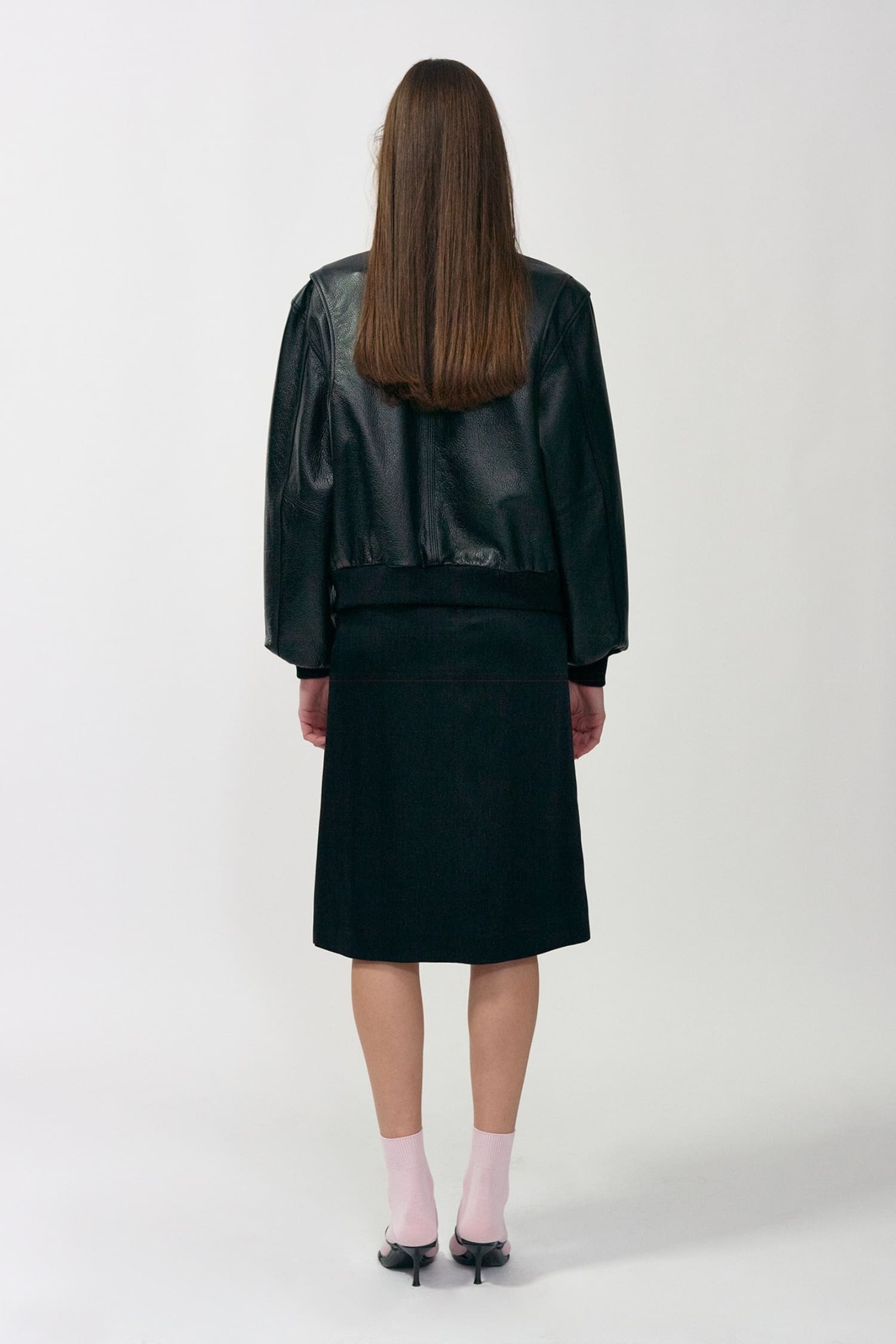 Nothing Written black leather bomber jacket back view with clean structured fit