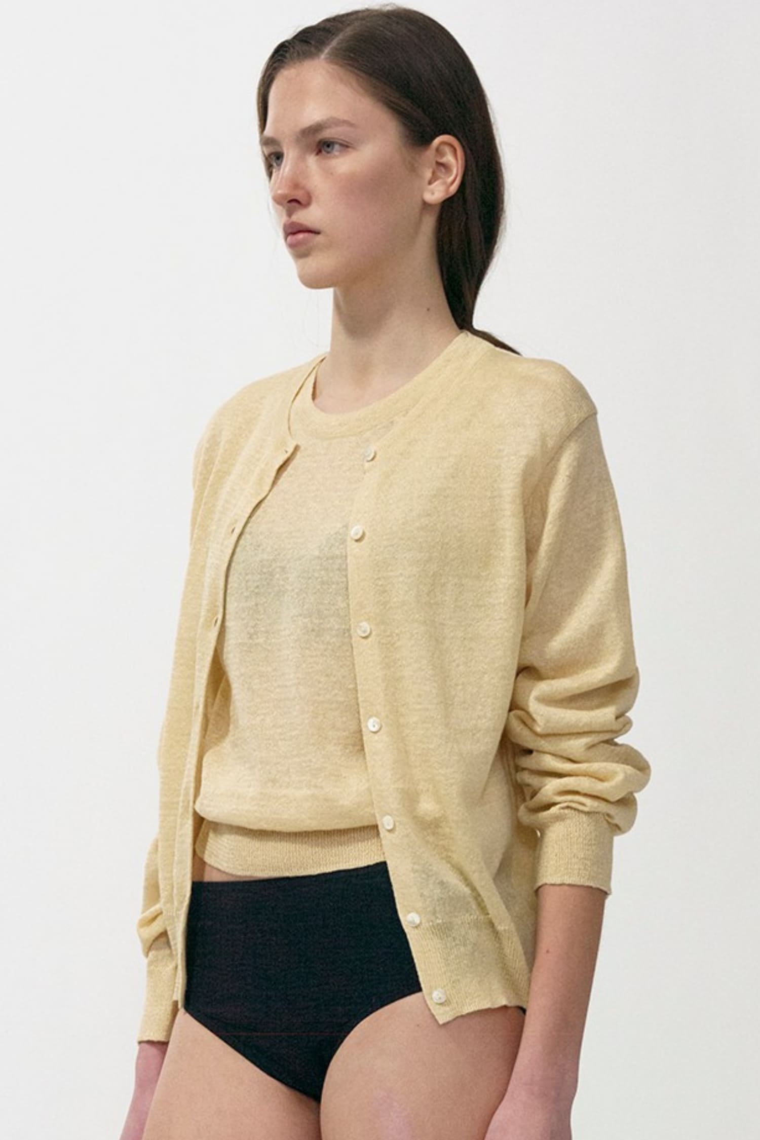 Nothing Written lightweight yellow linen cardigan worn close-up | hover