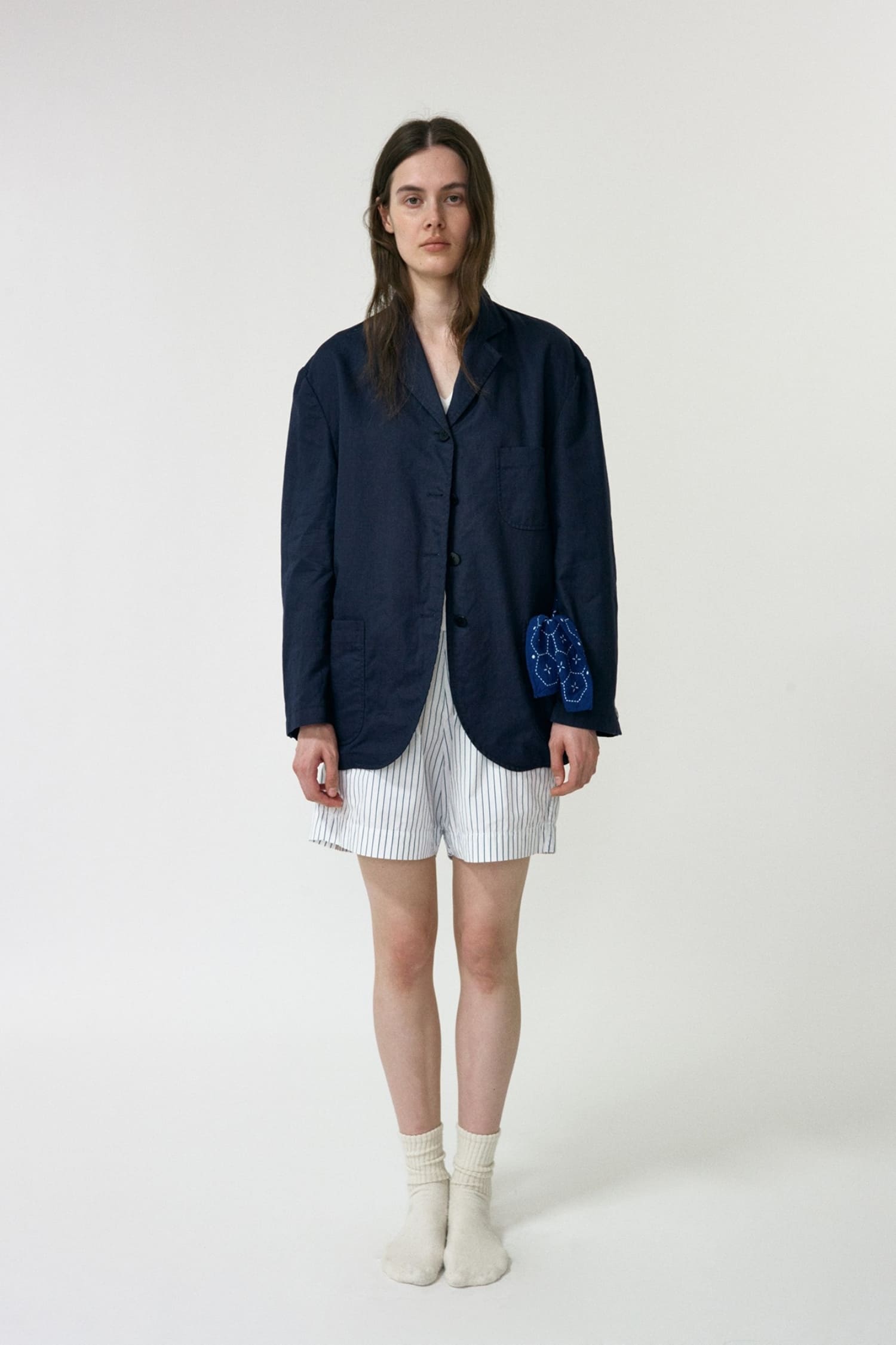 Nothing Written navy oversized linen jacket worn front view with relaxed tailored silhouette