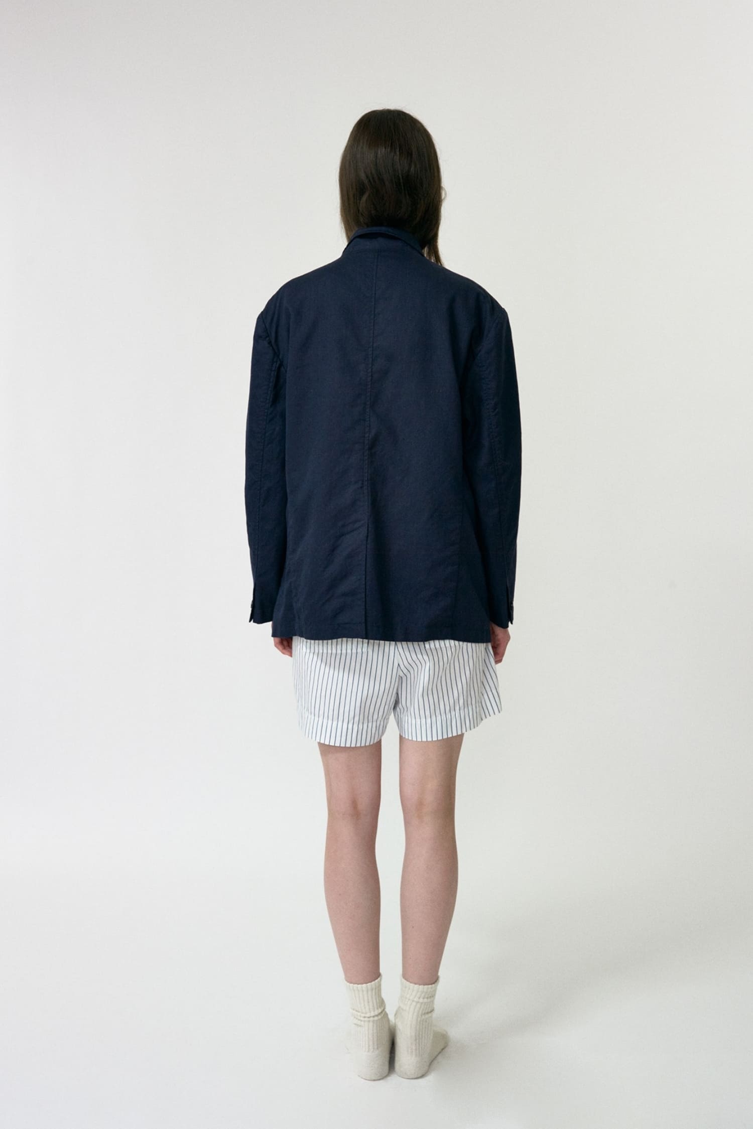 Nothing Written navy oversized linen jacket back view with clean structured cut