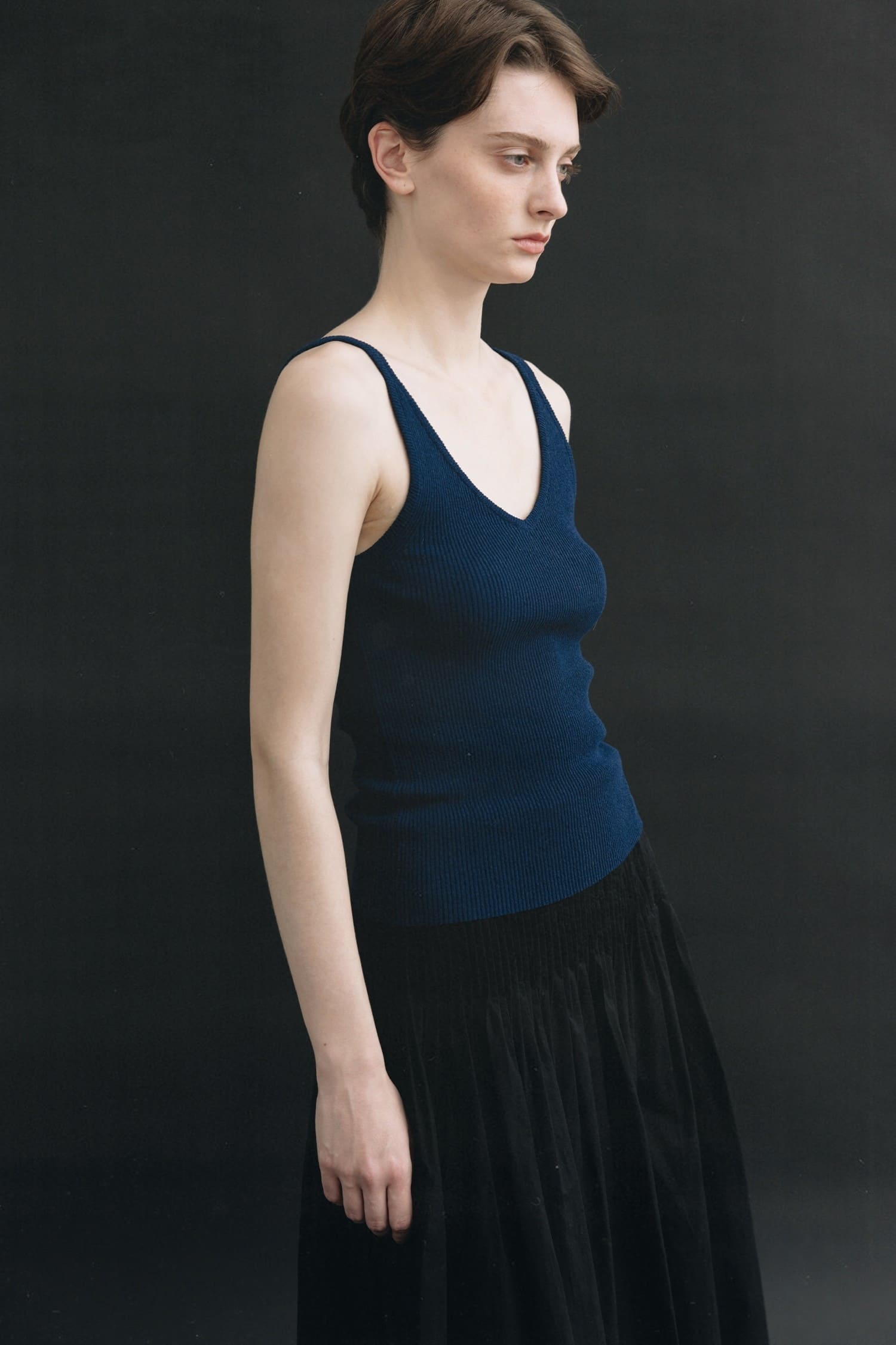 Nothing Written navy V-neck sleeveless knit top worn side view