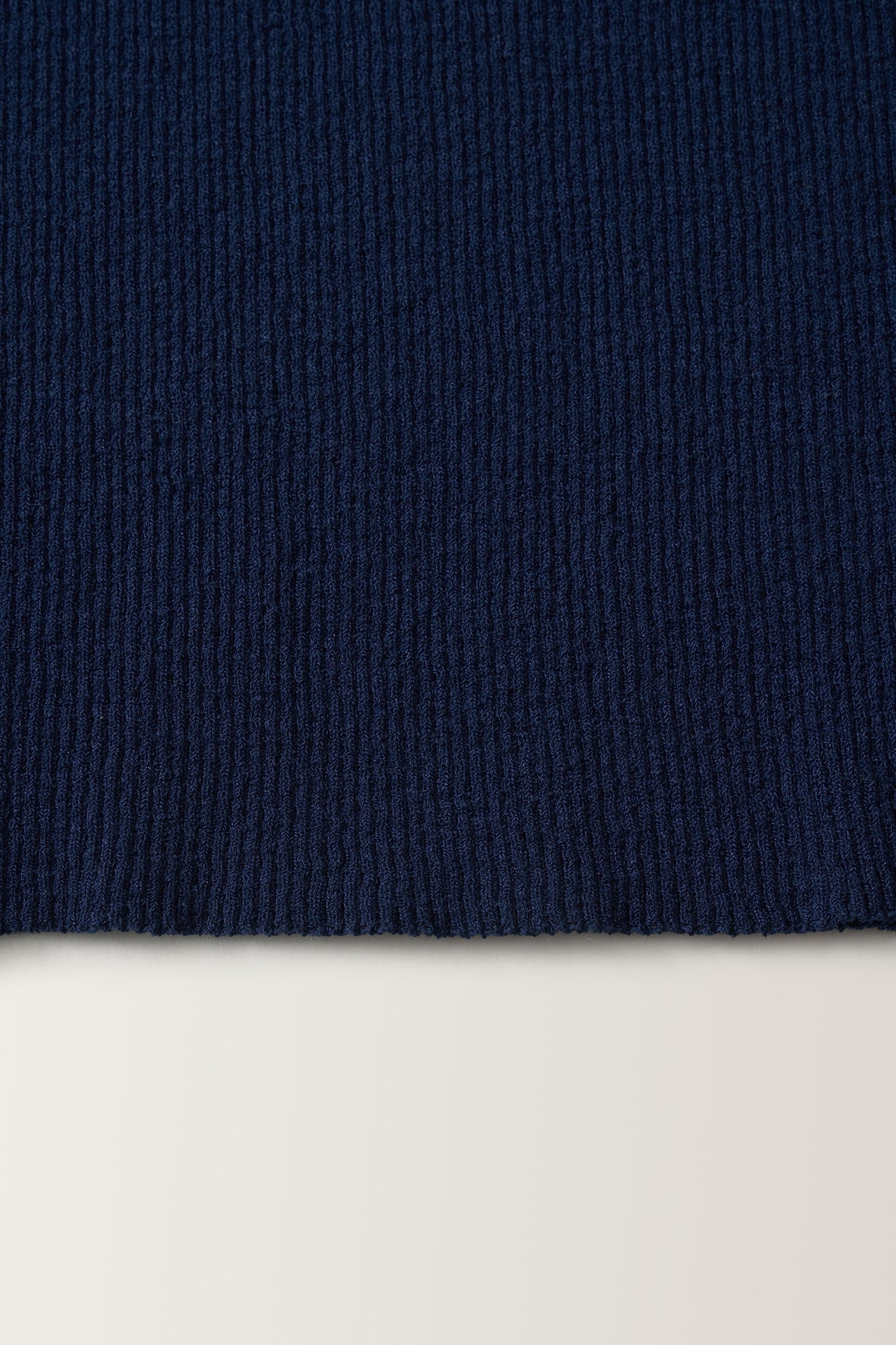 Close-up of ribbed knit texture on Nothing Written navy sleeveless top