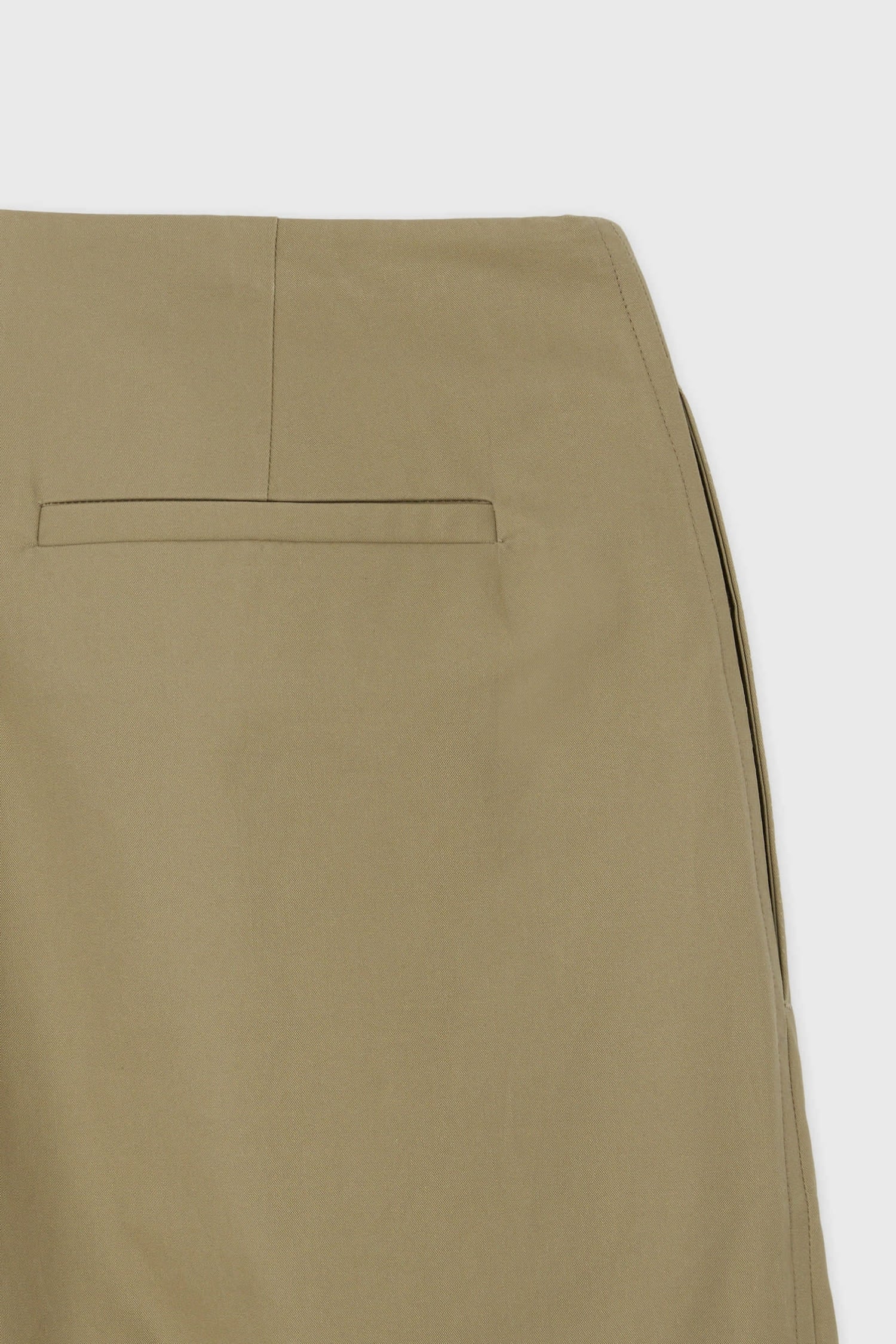Back pocket detail on The Loom beige tailored wrap trousers