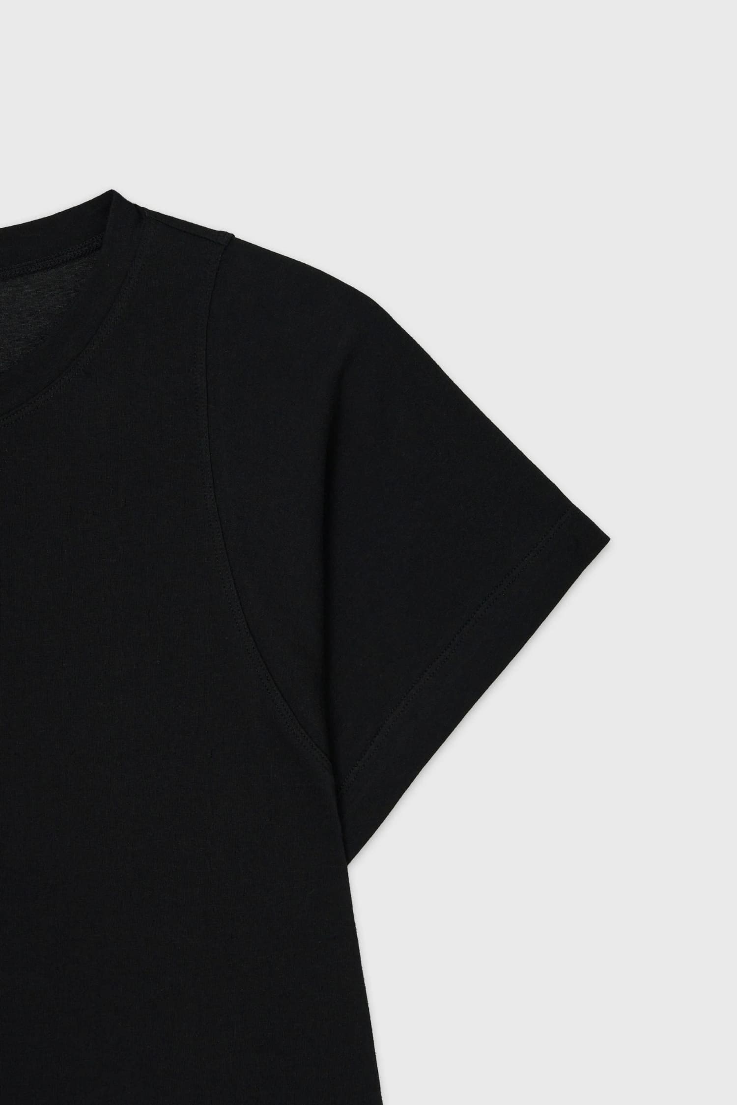 Detail of layered sleeve construction on The Loom black cotton minimalist T-shirt