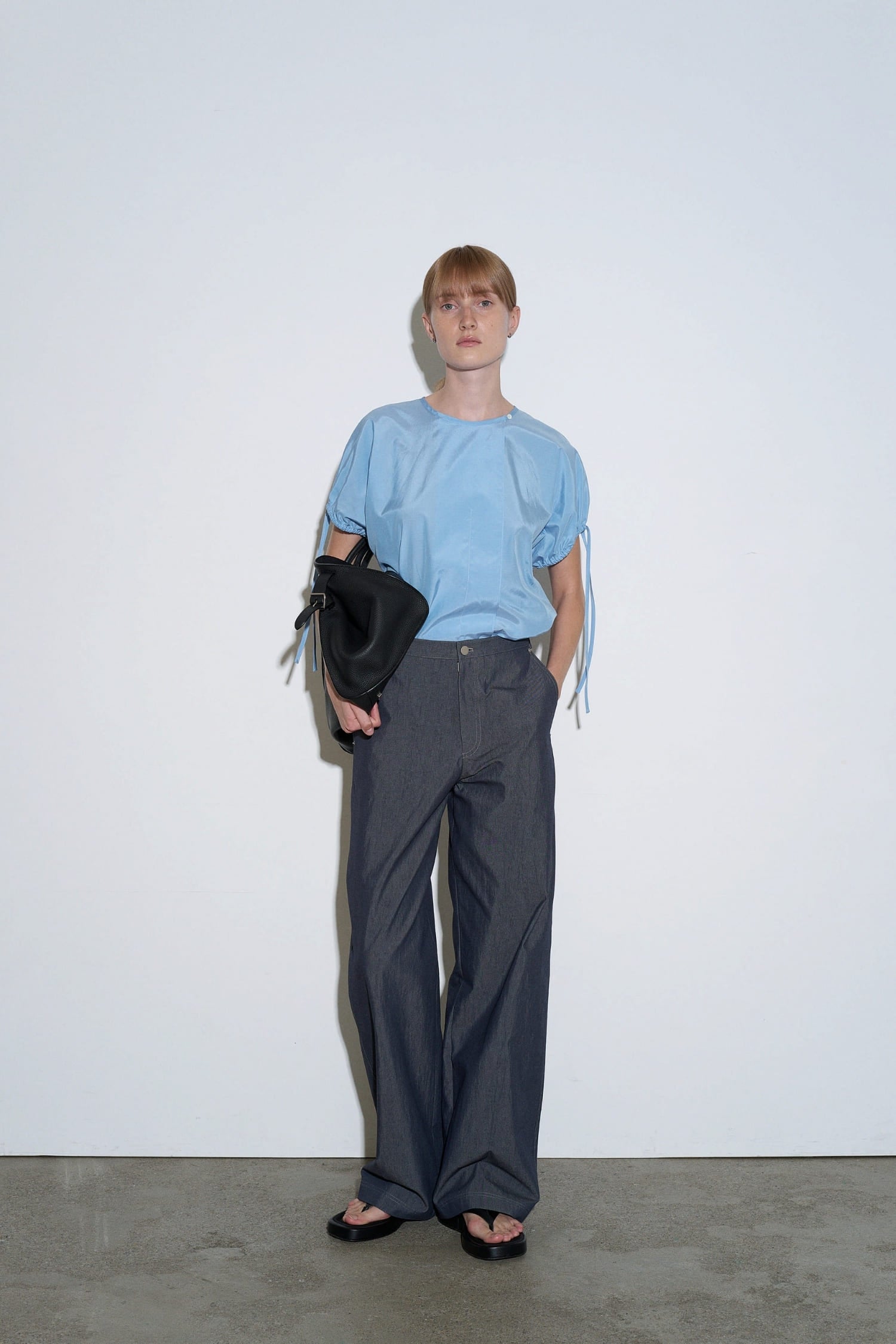  The Loom indigo denim barrel trousers front view with high waist and wide curved leg | hover