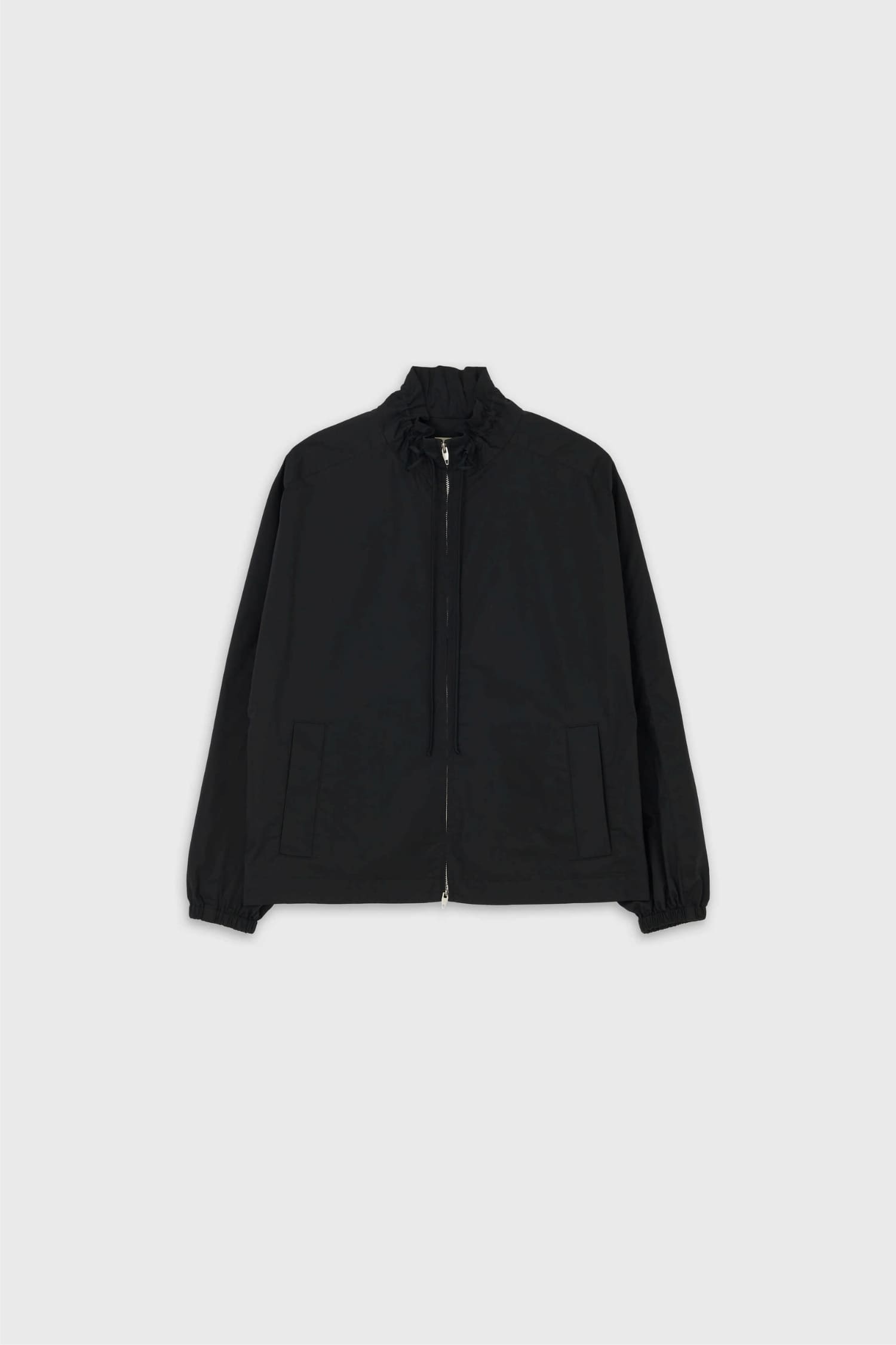 The Loom black drawstring neck jacket flat lay front view with zip closure and patch pockets | hover