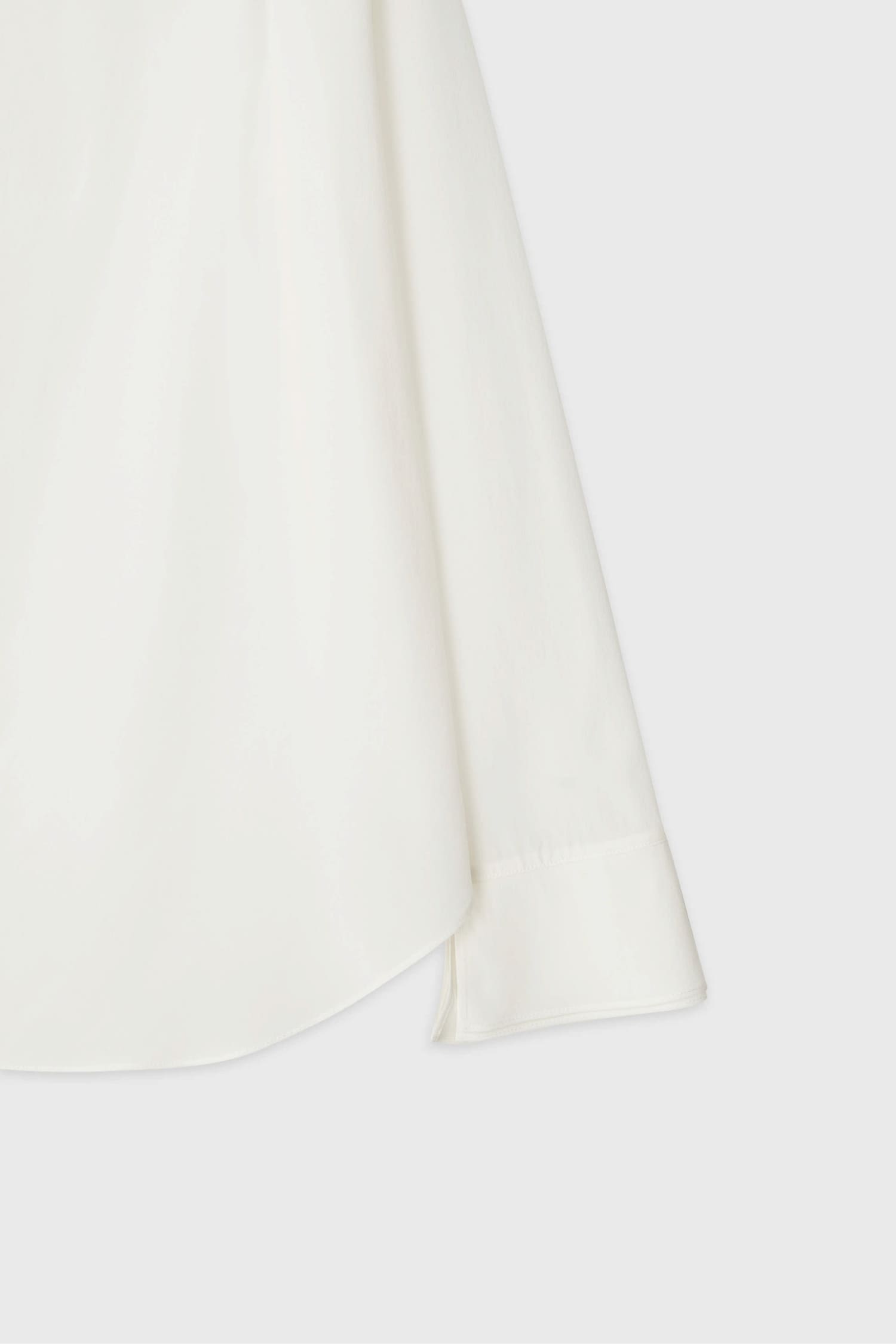 Detail of cuff and sleeve on The Loom white silk open shirt