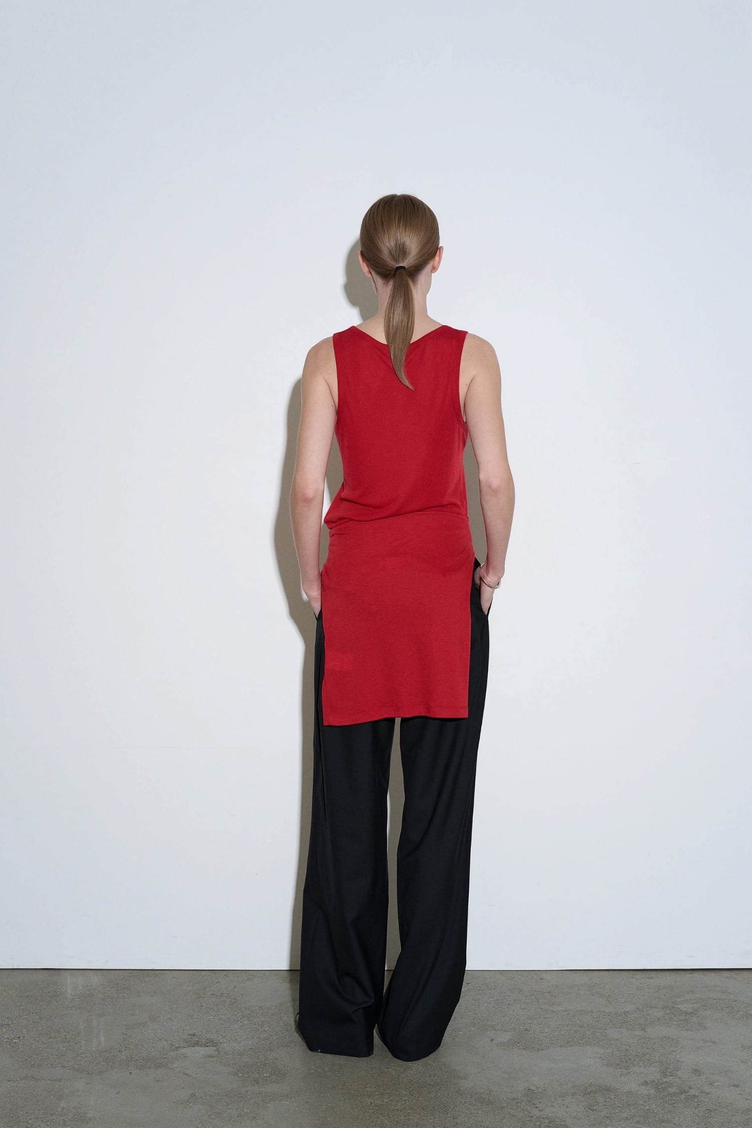 The Loom red sleeveless cotton top back view with clean minimalist silhouette