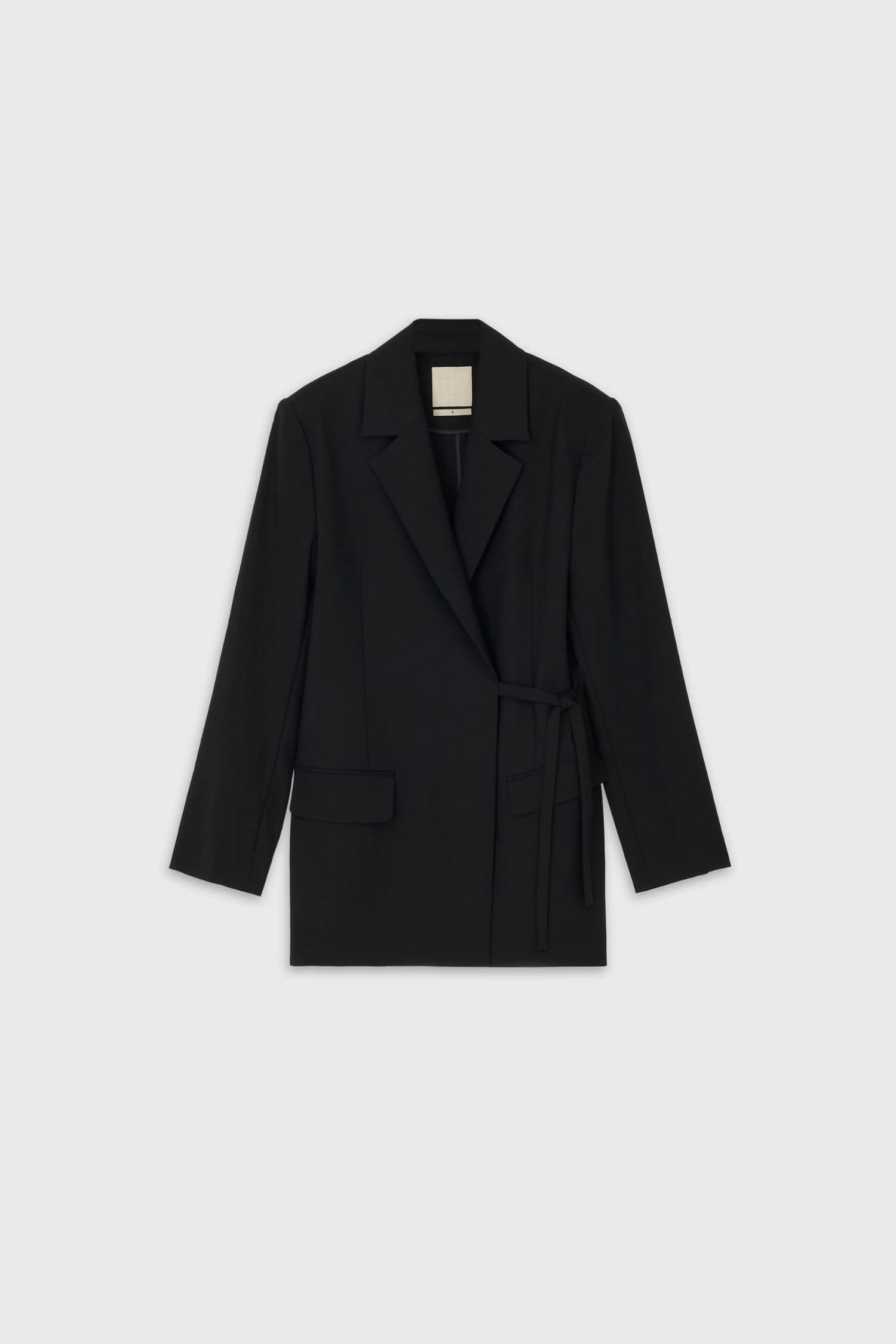 The Loom black wool tie jacket flat lay front view with asymmetric wrap closure